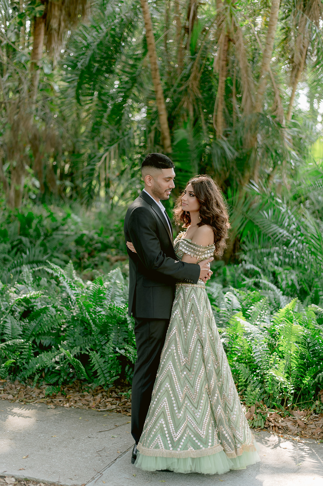 "Indian bride and groom in love during their engagement session at the Ringling Museum"
