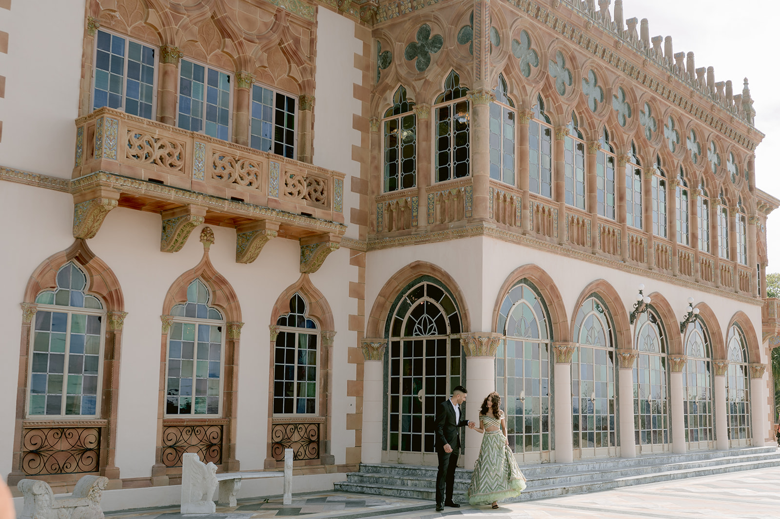"Indian couple in love poses in front of the breathtaking Ca' d'Zan mansion at the Ringling Museum"
