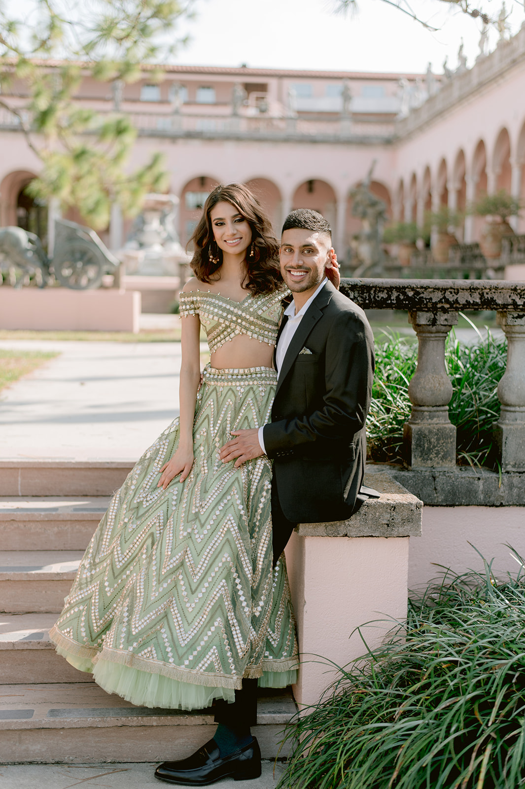 "Ringling Museum engagement shoot featuring pastel green and gold Indian outfit and stunning location"

