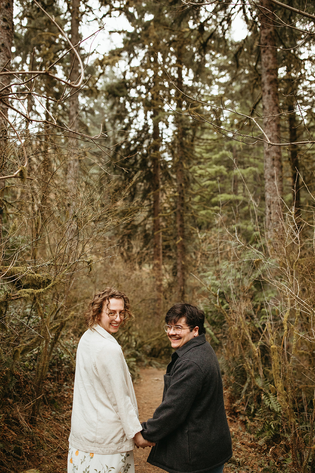 Couple in the forrest for their engagement session