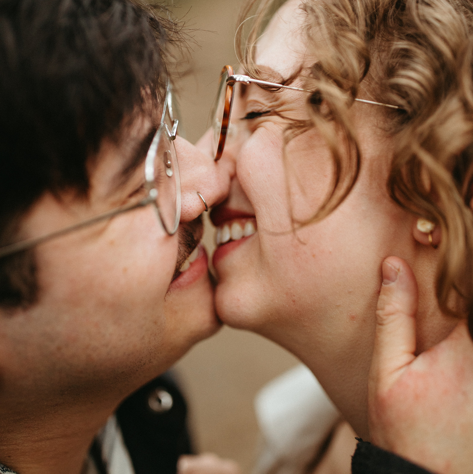 Couple teeth kissing during engagement session