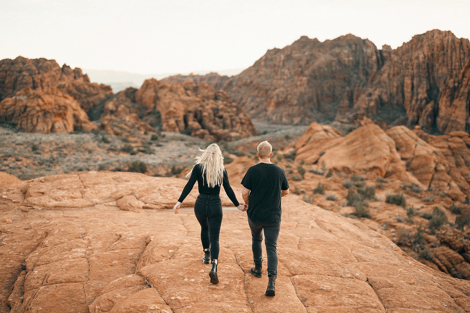 Snow Canyon Engagement photos, walking on the red rocks