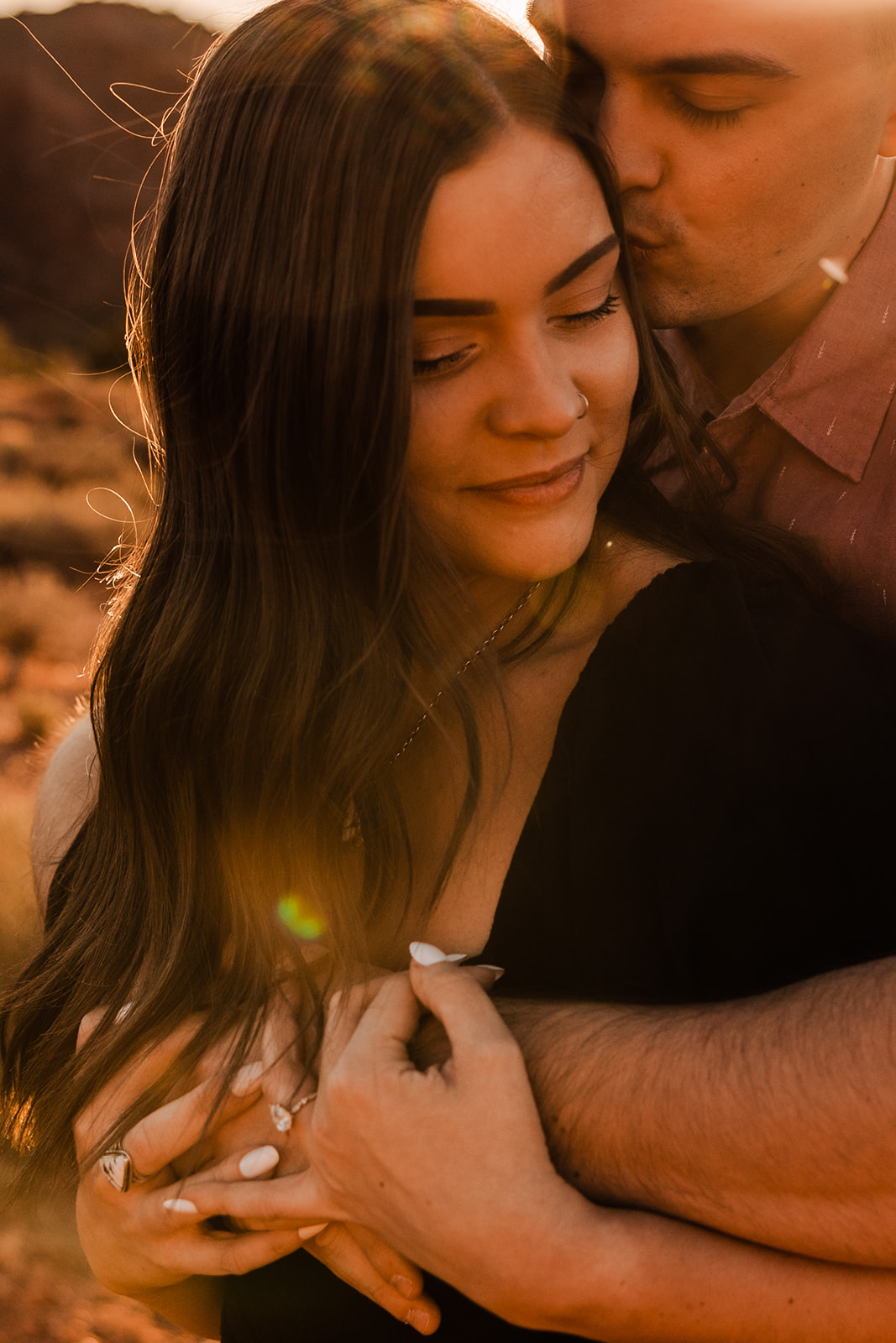 couple at sunset for their engagement portraits