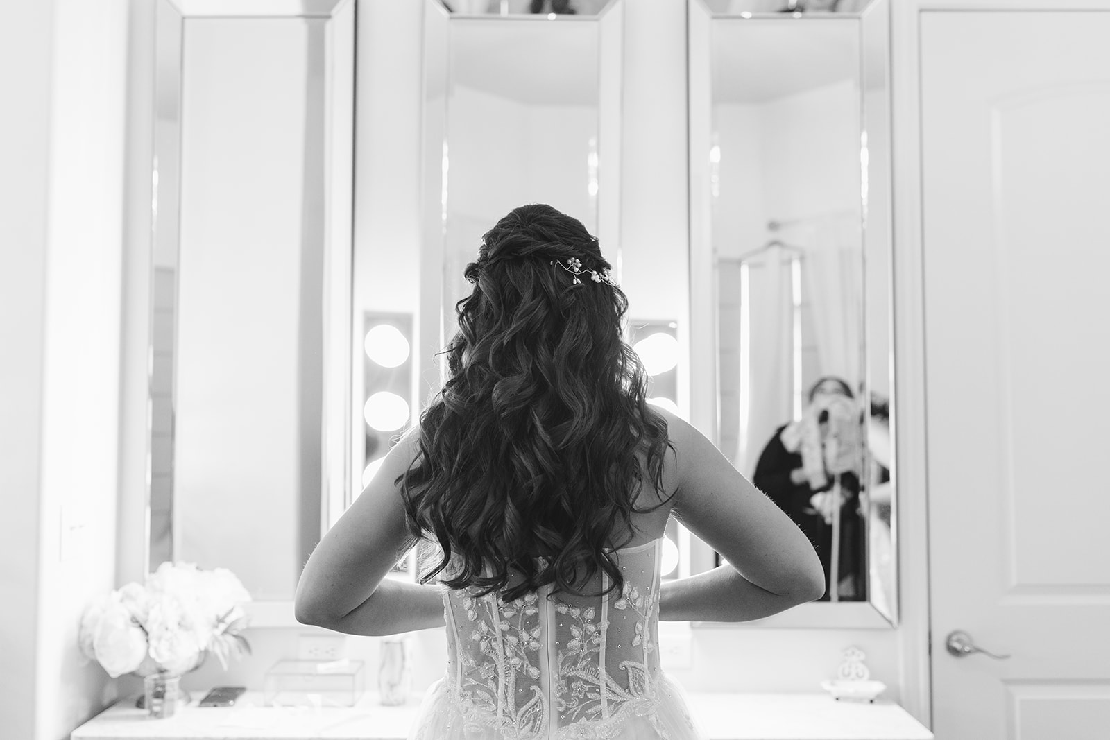 a bride looking at herself after she is ready