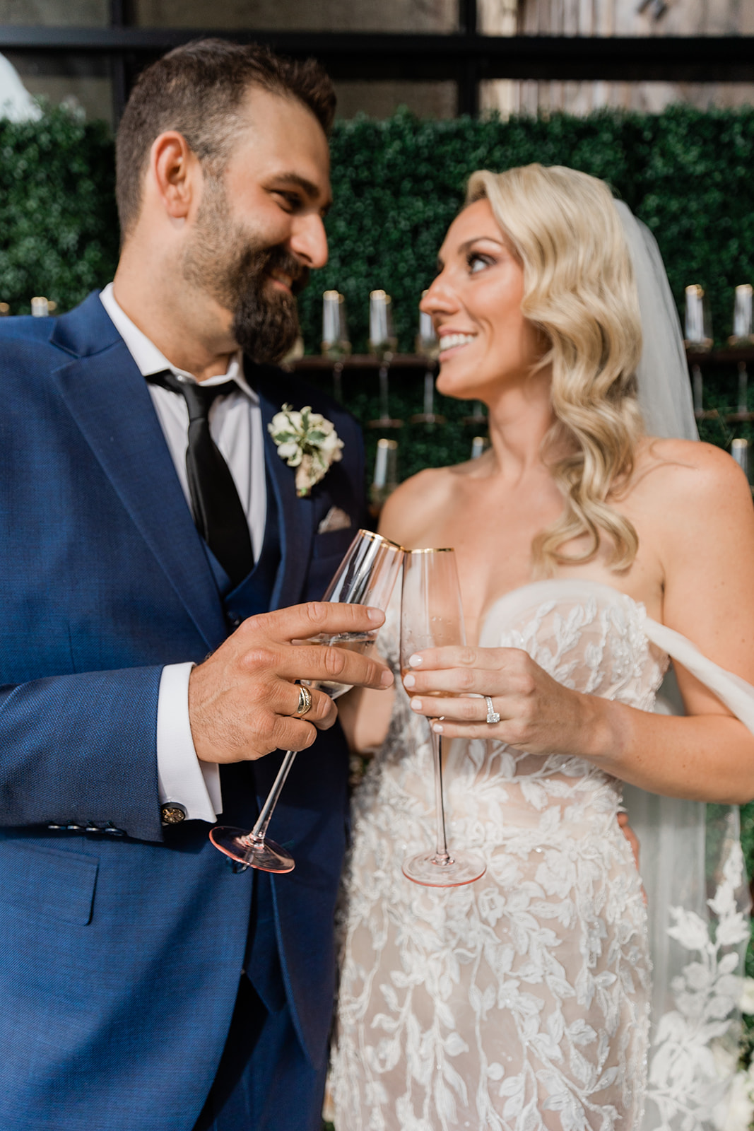 bride and groom cheers at farm to table wedding by jess collins photography