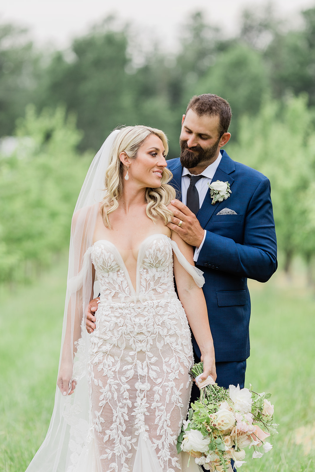 bride and groom orchard portrait at farm to table wedding by jess collins photography
