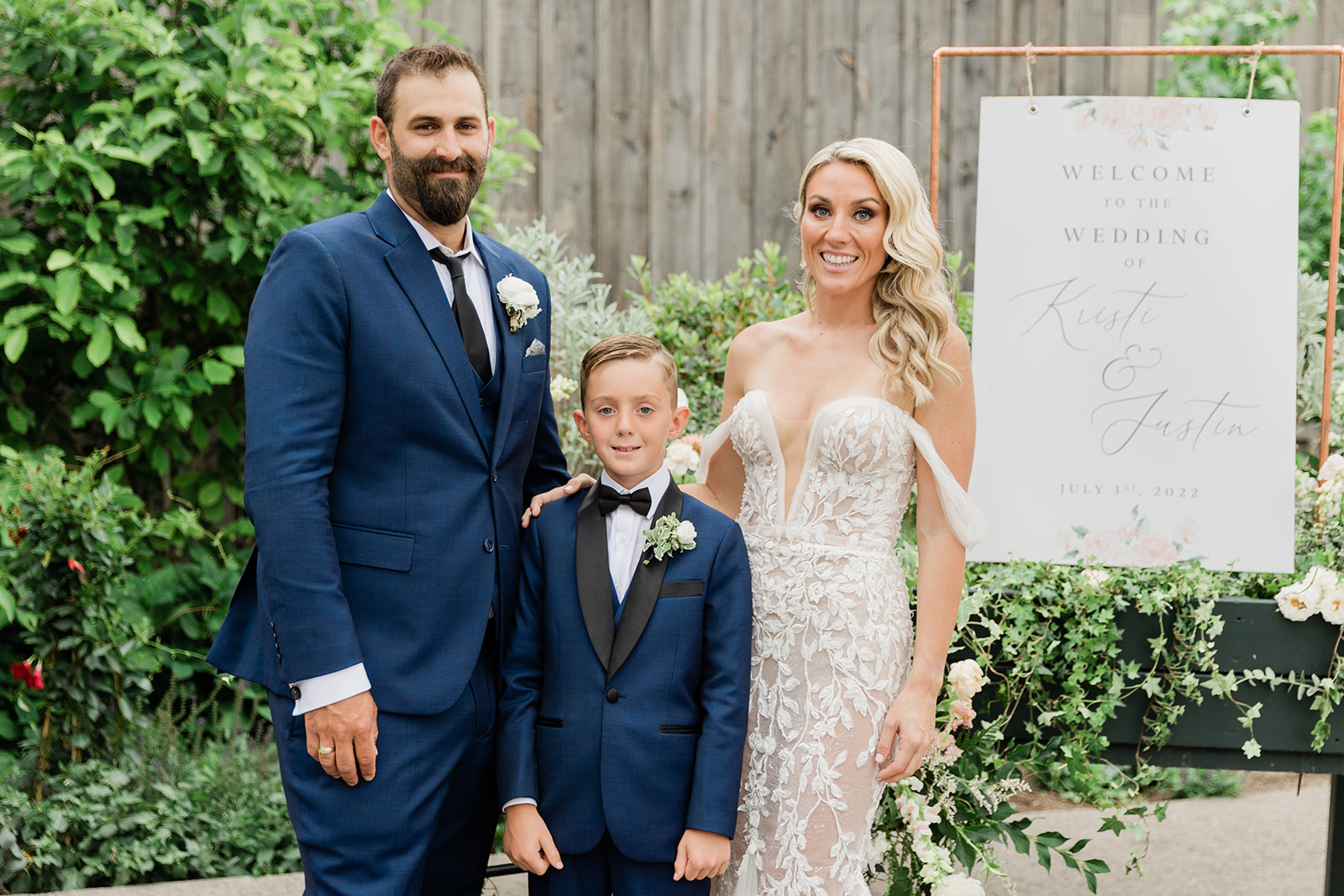 bride groom son family photo at farm to table wedding by jess collins photography