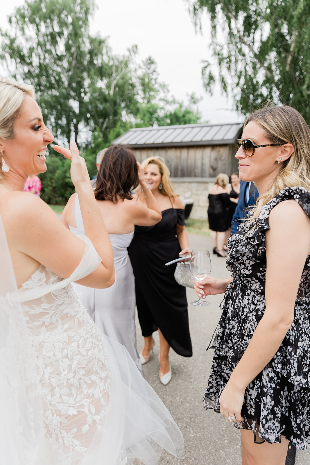 bride laughing at cocktail hour at farm to table wedding by jess collins photography