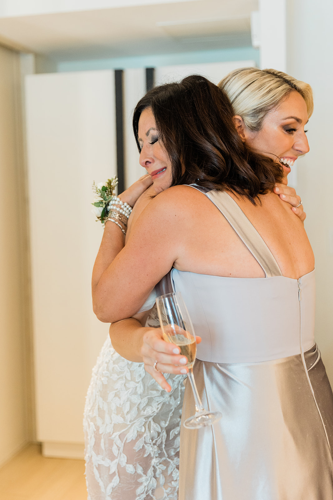 bride prep hugging mother at farm to table wedding by jess collins photography