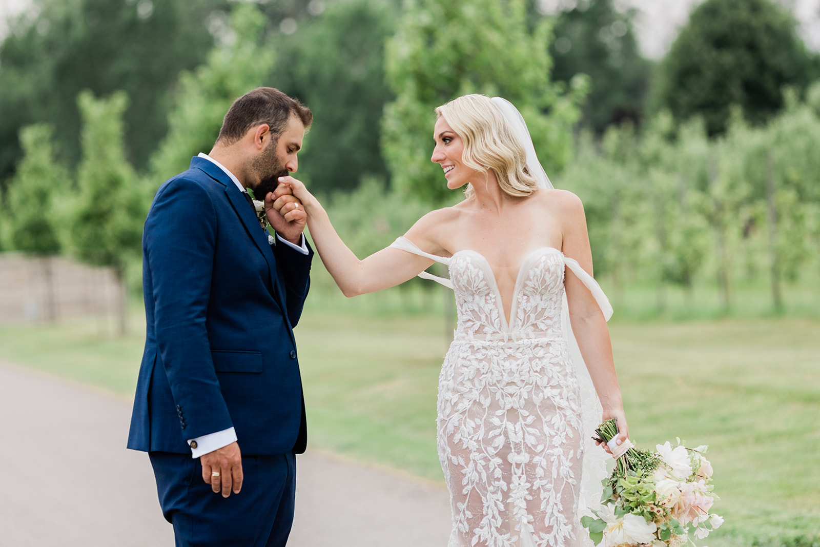 goom kissing bride at farm to table wedding by jess collins photography