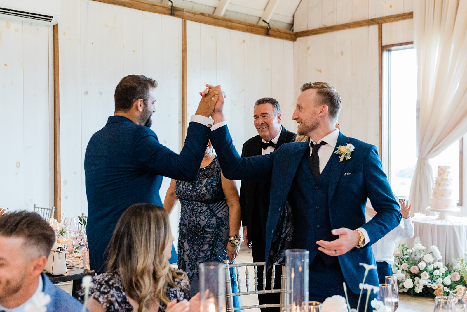 groom best man high five at farm to table wedding by jess collins photography