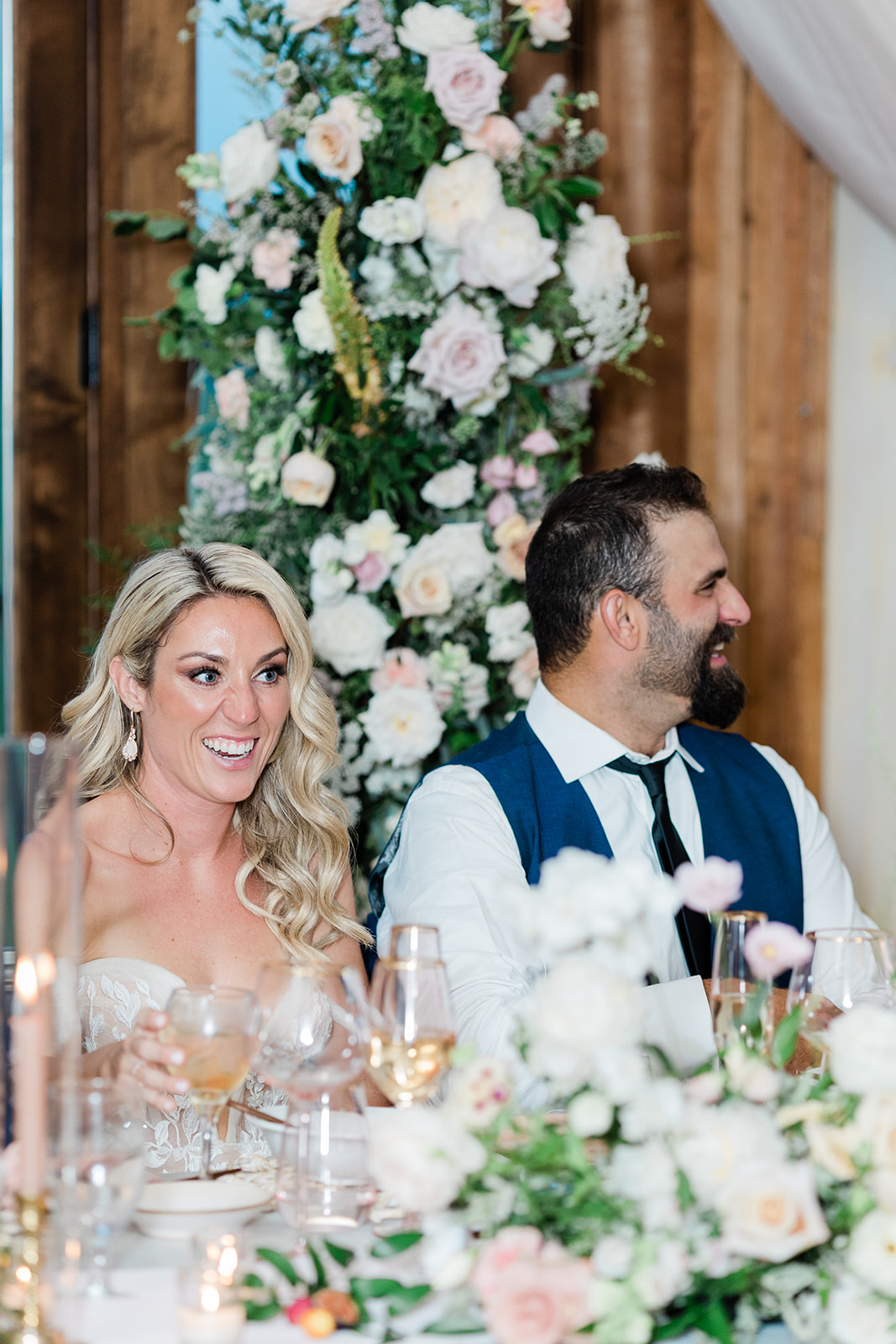 head table bride and groom laugh at farm to table wedding by jess collins photography