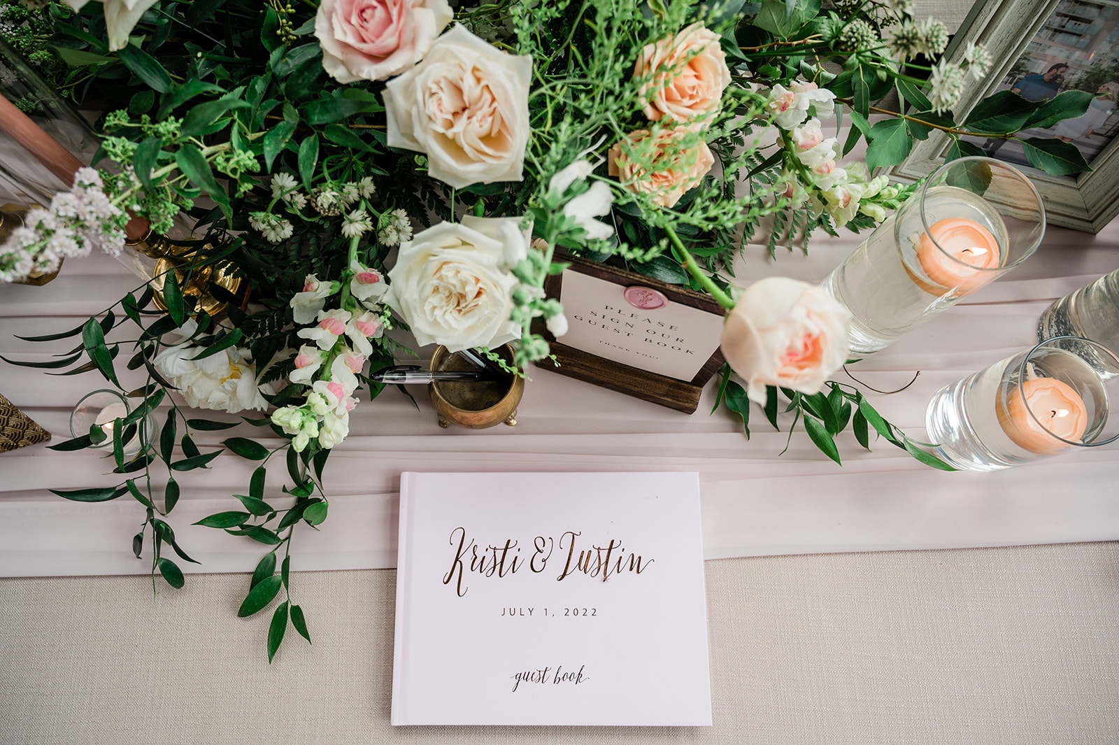 reception welcome table flowers at farm to table wedding by jess collins photography
