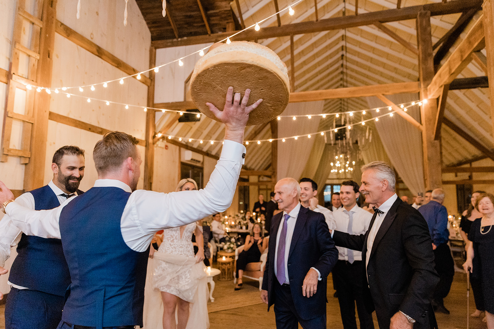 traditional greek bread dance at farm to table wedding by jess collins photography