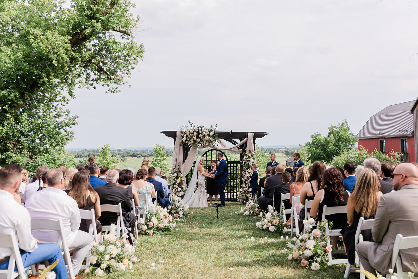 wedding ceremony isle photo at farm to table wedding by jess collins photography