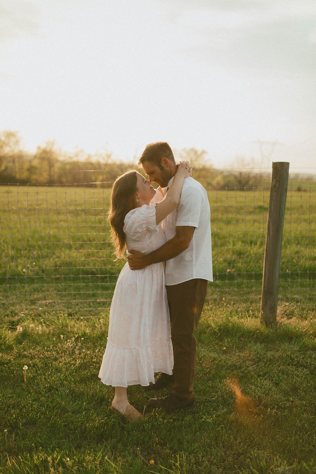 Couples photo shoot in a field