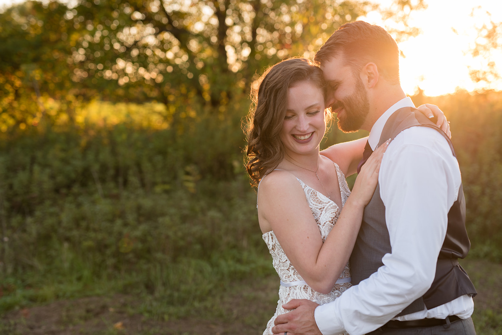 Golden hour photos with bride and groom at Erickson Farmstead wedding in Isanti Minnesota