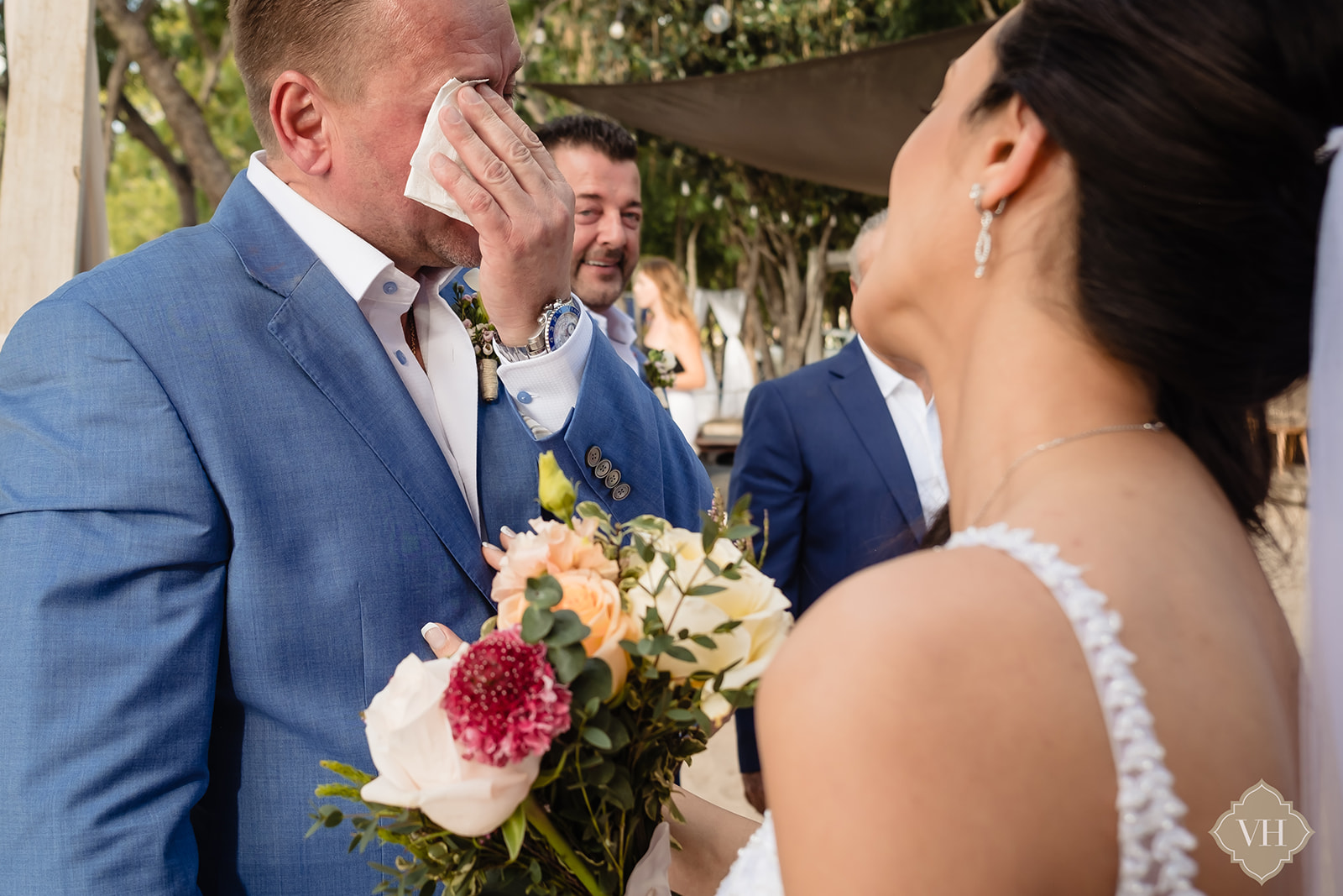 Groom wiping his tears of joy during his vows at Catherine's Cafe Antigua. 