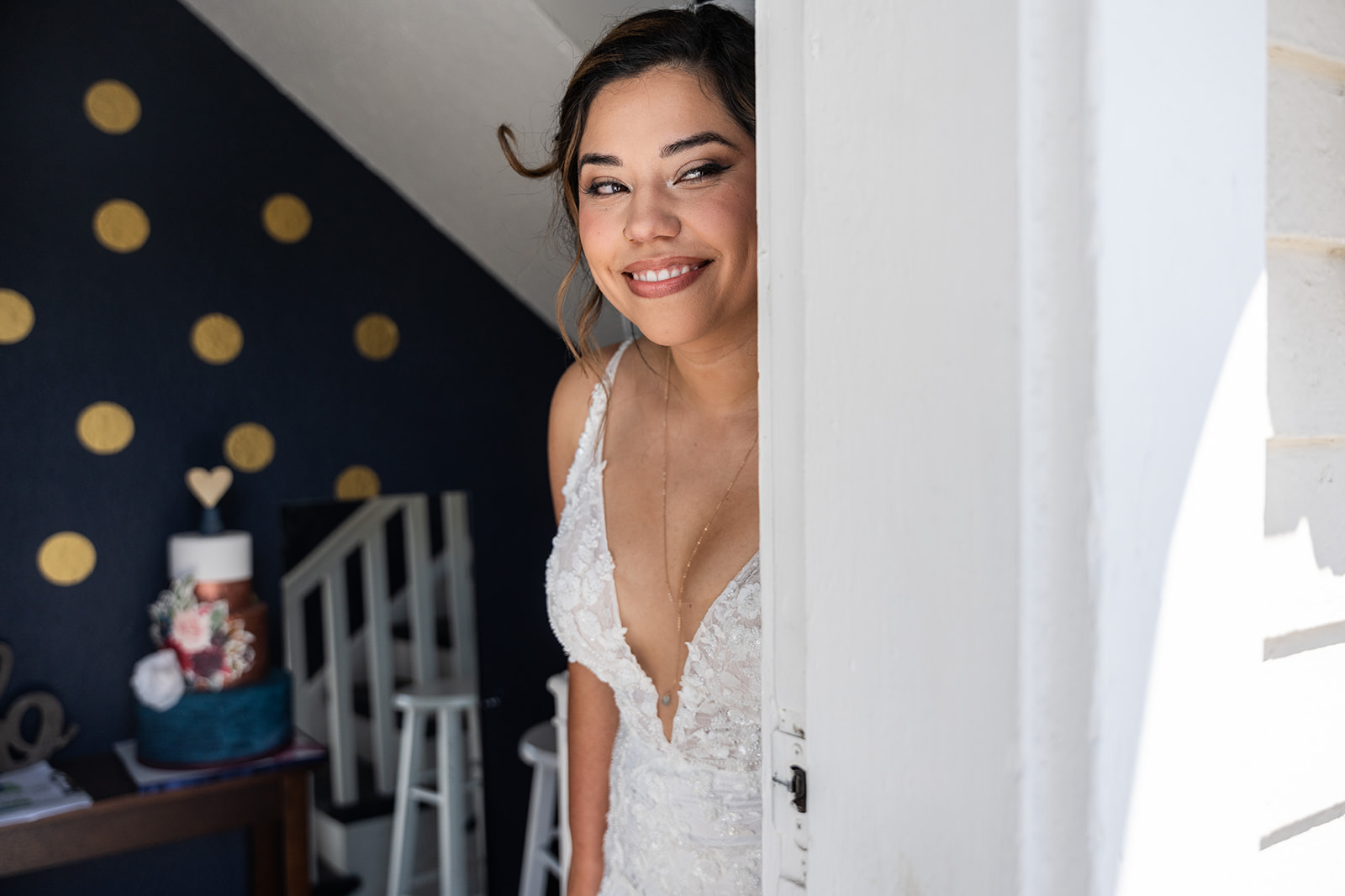 bride peeking at her wedding before walking down the aisle