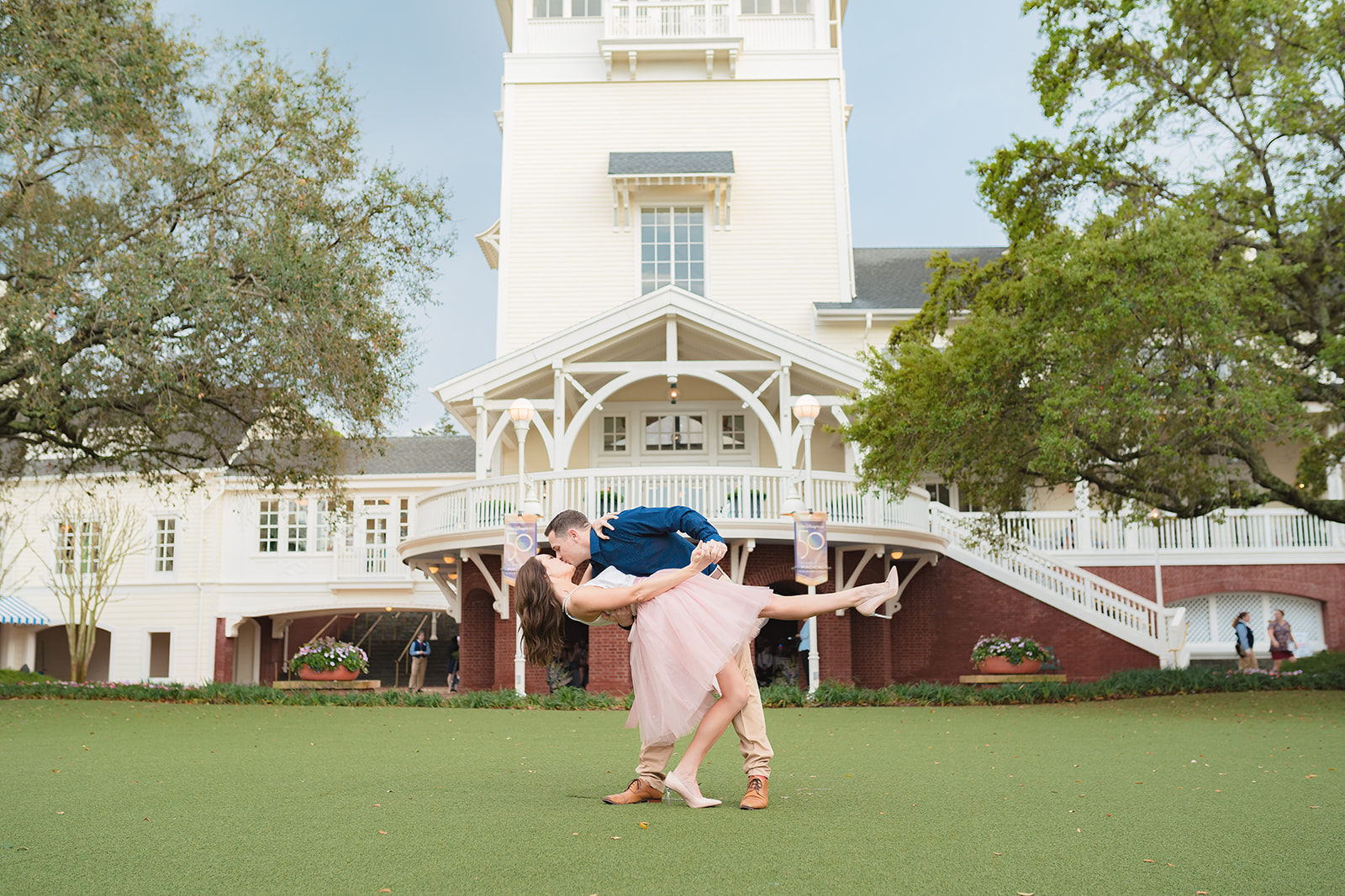 Dip kiss at Disney's BoardWalk during Orlando Engagement Session
