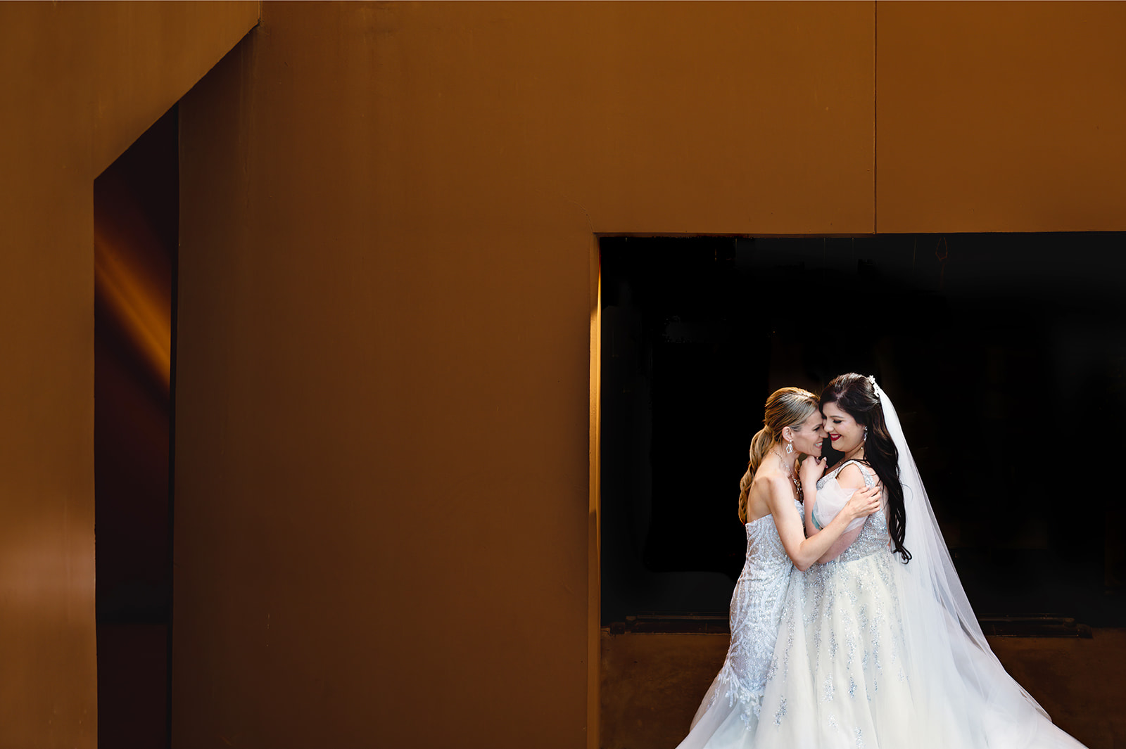 two brides embracing in colour photo in Las Vegas