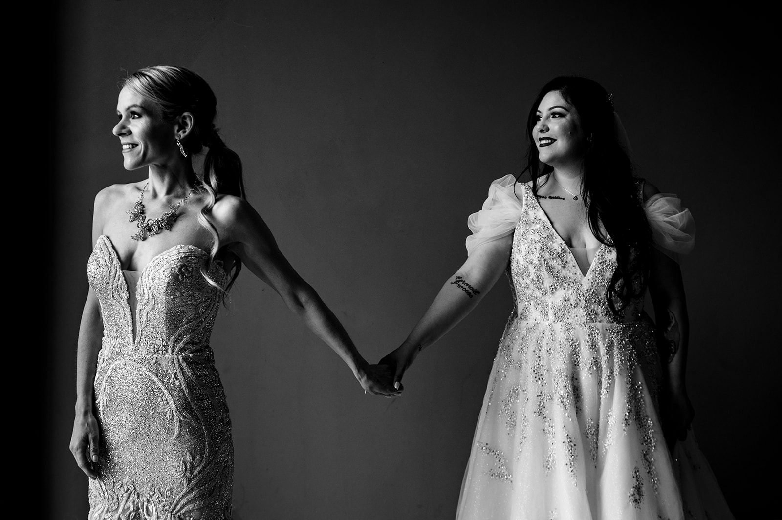 BW photo of two brides holding hands in Las Vegas