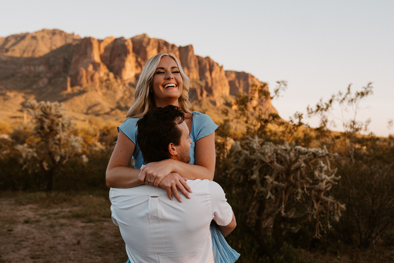 Candid engagement photos in Lost Dutchman State Park