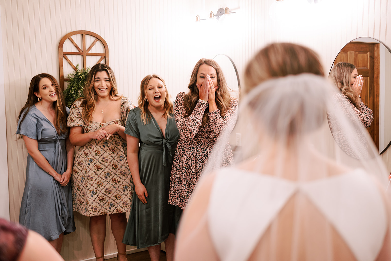bride has first look with her best friends on her wedding day