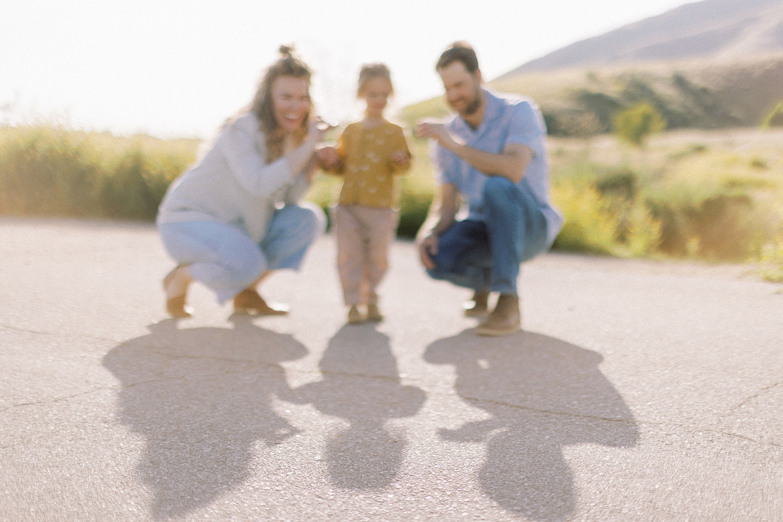 Family making shadow puppets during family session in Southern California.