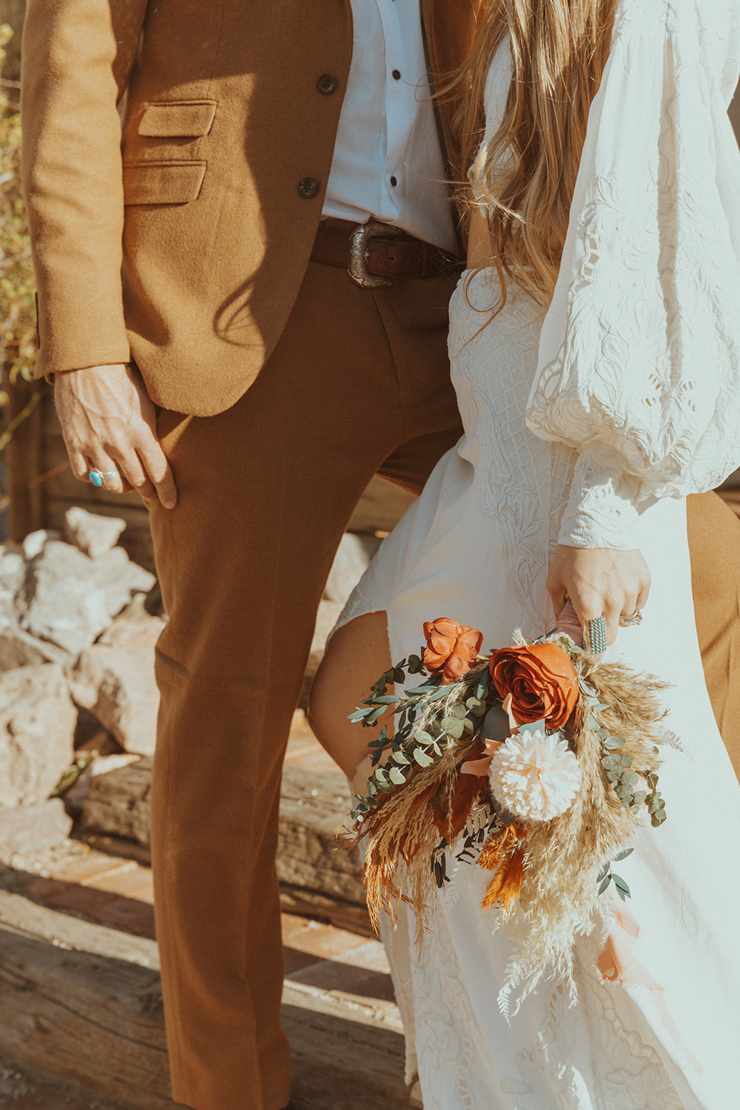 Bride and Groom Details in Desert Oranges