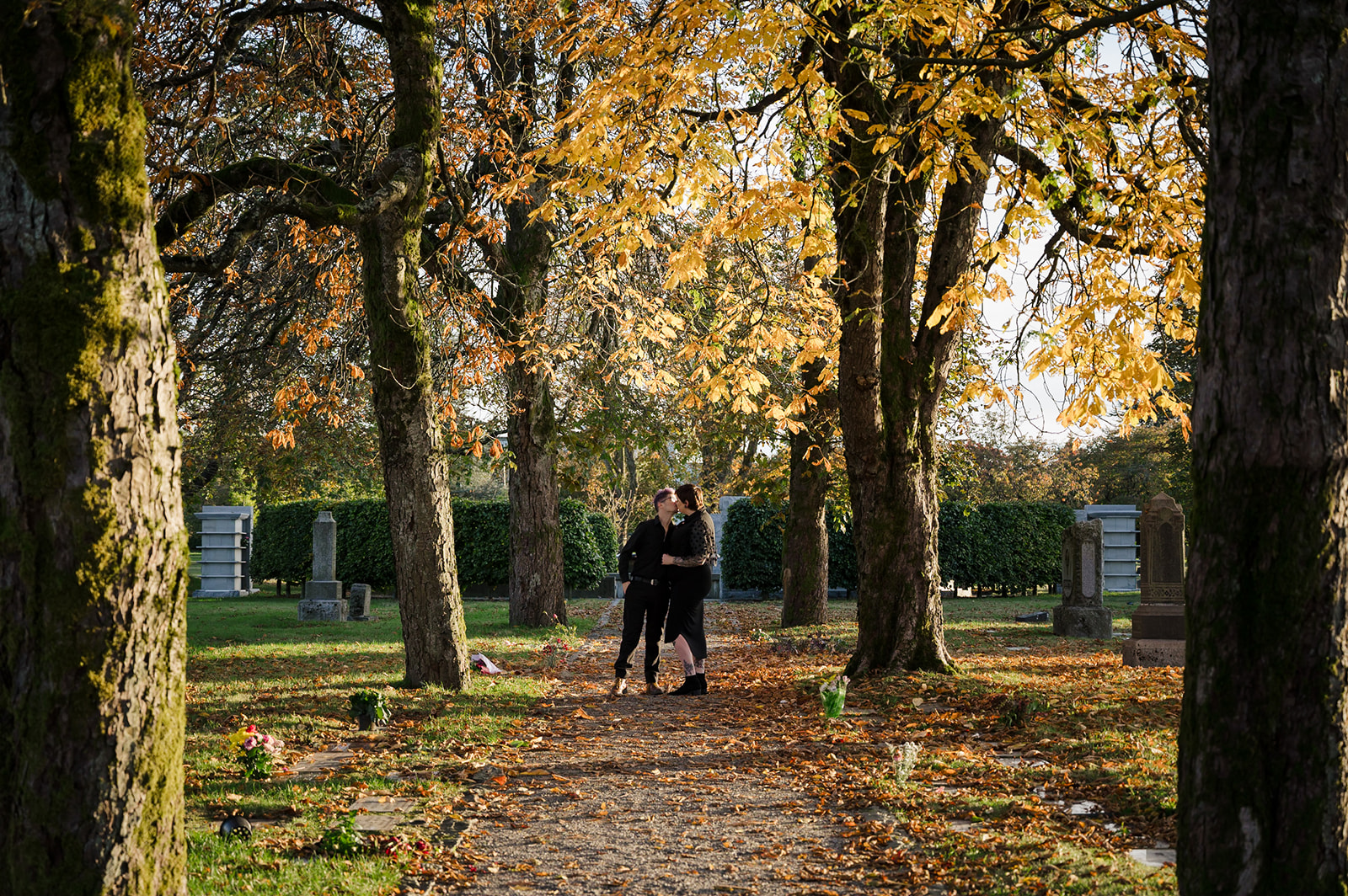 couple walking through cemetery