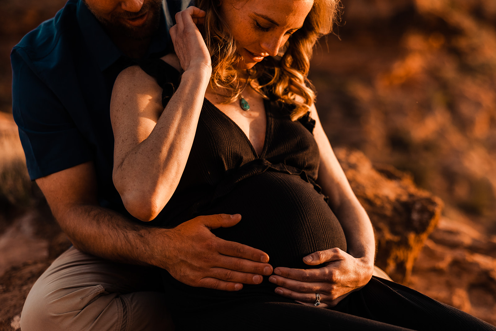 sunset maternity photos on a hike in moab